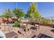 Backyard firepit and patio area is great for outdoor entertaining at 10561 E Plata Ave, Mesa, AZ 85212