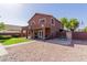 Exterior view of a two-story home with large yard and brick accents at 10561 E Plata Ave, Mesa, AZ 85212