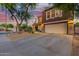 Charming two-story home featuring low-maintenance desert landscaping, a two-car garage, and an inviting front porch at 10561 E Plata Ave, Mesa, AZ 85212