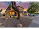 Charming two-story home featuring low-maintenance desert landscaping, a two-car garage, and an inviting front porch at 10561 E Plata Ave, Mesa, AZ 85212