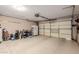 Spacious garage with ample room for parking and storage, featuring an automatic garage door opener at 10561 E Plata Ave, Mesa, AZ 85212
