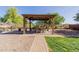 Lovely backyard gazebo offers an excellent outdoor entertaining space at 10561 E Plata Ave, Mesa, AZ 85212