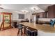 This lovely kitchen features granite countertops, an island with barstool seating, and stainless steel appliances at 10561 E Plata Ave, Mesa, AZ 85212