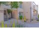 Exterior view of a modern apartment building with well-maintained landscaping and a pedestrian walkway at 11333 N 92Nd St # 1085, Scottsdale, AZ 85260