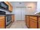 Functional kitchen features stainless appliances, tile flooring and a large pantry at 11333 N 92Nd St # 1085, Scottsdale, AZ 85260