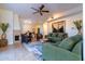 Inviting living room features stylish decor, comfortable seating, fireplace, and modern ceiling fan at 11333 N 92Nd St # 1085, Scottsdale, AZ 85260