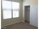 Bedroom with neutral carpet, closet and a window that offers natural light at 13549 W Paso Trl, Peoria, AZ 85383