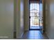 View from the entryway, with tile floors, security door, and a view to the front yard at 13549 W Paso Trl, Peoria, AZ 85383