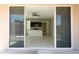 Living area with tile floors and kitchen featuring dark cabinets and granite counters at 13549 W Paso Trl, Peoria, AZ 85383