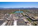 Breathtaking aerial view showcasing a picturesque lake with a fountain amidst desert landscape and distant mountains at 13700 N Fountain Hills Blvd # 135, Fountain Hills, AZ 85268