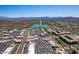 Scenic aerial view showcasing a picturesque lake with a fountain amidst desert landscape and distant mountains at 13700 N Fountain Hills Blvd # 135, Fountain Hills, AZ 85268