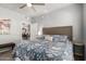 Comfortable bedroom with a floral patterned bedspread, neutral walls, and a view into the dining area at 13700 N Fountain Hills Blvd # 135, Fountain Hills, AZ 85268