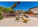 Monument sign for Four Peaks Condominium Homes featuring lush desert landscaping at 13700 N Fountain Hills Blvd # 135, Fountain Hills, AZ 85268