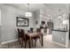 Cozy dining room featuring a wooden table with seating for four and a view into the modern kitchen at 13700 N Fountain Hills Blvd # 135, Fountain Hills, AZ 85268