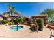 Community hot tub surrounded by desert landscaping and stonework in an outdoor setting at 13700 N Fountain Hills Blvd # 135, Fountain Hills, AZ 85268
