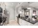 Charming kitchen with white cabinetry, stainless steel appliances, and a view into the living area at 13700 N Fountain Hills Blvd # 135, Fountain Hills, AZ 85268