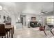 Bright and airy living room showcasing an open layout, a black leather sofa, and easy access to the kitchen at 13700 N Fountain Hills Blvd # 135, Fountain Hills, AZ 85268