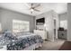 Spacious main bedroom featuring a ceiling fan, window, and ensuite bathroom access at 13700 N Fountain Hills Blvd # 135, Fountain Hills, AZ 85268