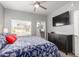 Bedroom with a ceiling fan, window, and dresser with an ensuite closet at 13700 N Fountain Hills Blvd # 135, Fountain Hills, AZ 85268