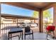 Relaxing covered patio with outdoor seating, grill and views of covered parking area at 13700 N Fountain Hills Blvd # 135, Fountain Hills, AZ 85268