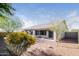Landscaped backyard boasts desert landscaping and a covered patio area at 1399 E Anna Dr, Casa Grande, AZ 85122
