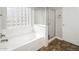 Bright bathroom features a soaking tub with glass block window and a glass shower at 1399 E Anna Dr, Casa Grande, AZ 85122