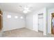 A carpeted bedroom features three windows with shutters and a closet with a sliding door at 1399 E Anna Dr, Casa Grande, AZ 85122