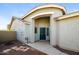 Inviting front entrance with a covered porch, security door, and neutral-toned exterior at 1399 E Anna Dr, Casa Grande, AZ 85122