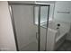 Bathroom featuring a shower and separate soaking tub with a window at 14224 W Hackamore Dr, Surprise, AZ 85387