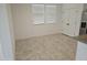 Bright dining area featuring tile floors, white walls and dual windows at 14224 W Hackamore Dr, Surprise, AZ 85387