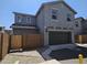 Attractive two-story home with a two-car garage and a private brick-walled yard, perfect for outdoor activities at 14224 W Hackamore Dr, Surprise, AZ 85387