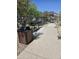 Outdoor grilling area with a modern grill, trash receptacle, and ample space for cooking and entertaining guests at 14224 W Hackamore Dr, Surprise, AZ 85387