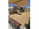 Community playground with a large slide, climbing structures, and a cushioned ground cover for safe play at 14224 W Hackamore Dr, Surprise, AZ 85387