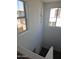 Bright staircase with multiple windows allowing for ample natural light at 14224 W Hackamore Dr, Surprise, AZ 85387