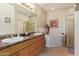 Spacious bathroom with double sinks, a soaking tub, and a separate shower stall at 14250 W Wigwam Blvd # 2126, Litchfield Park, AZ 85340