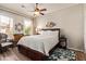 Comfortable bedroom featuring a bed, a ceiling fan, and a bright window at 14250 W Wigwam Blvd # 2126, Litchfield Park, AZ 85340
