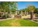Beautiful community grill area with stone accents and lush landscaping at 14250 W Wigwam Blvd # 2126, Litchfield Park, AZ 85340