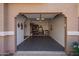 Spacious two-car garage with ample storage and black flooring at 14250 W Wigwam Blvd # 2126, Litchfield Park, AZ 85340