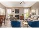 Bright living room with stylish decor, a fireplace, and plenty of natural light at 14250 W Wigwam Blvd # 2126, Litchfield Park, AZ 85340