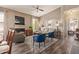 Open living area with fireplace, comfortable seating and view of the dining area at 14250 W Wigwam Blvd # 2126, Litchfield Park, AZ 85340