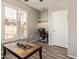 Bright office space with desk, built-in shelves, and modern window shutters at 14250 W Wigwam Blvd # 2126, Litchfield Park, AZ 85340
