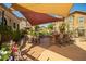Outdoor bar area with seating and shaded dining options at 14250 W Wigwam Blvd # 2126, Litchfield Park, AZ 85340