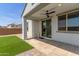 Covered back patio with ceiling fan provides a shaded outdoor living space at 14269 W El Cortez Pl, Surprise, AZ 85387