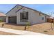 Charming home exterior with rock landscaping, sidewalk and desert-friendly trees at 14269 W El Cortez Pl, Surprise, AZ 85387