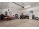 A spacious garage featuring an automatic door, ample storage and organization options at 14269 W El Cortez Pl, Surprise, AZ 85387