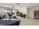 This is a well-lit living area with a ceiling fan and furniture at 14269 W El Cortez Pl, Surprise, AZ 85387
