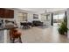 This is an expansive living area adjacent to an eat-in kitchen and a sliding door to the outdoor living space at 14269 W El Cortez Pl, Surprise, AZ 85387