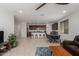 Bright open-concept living room with views of the kitchen and dining room, perfect for entertaining at 14269 W El Cortez Pl, Surprise, AZ 85387