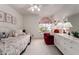 Bedroom with window, ceiling fan, a full-sized bed, and a red armchair at 15395 W Pinchot Ct, Goodyear, AZ 85395