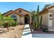 Charming single-story home featuring desert landscaping, a walkway, and a welcoming entrance at 15395 W Pinchot Ct, Goodyear, AZ 85395